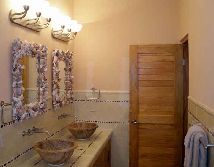 Custom stone sinks, shell mirrors, talavera tile